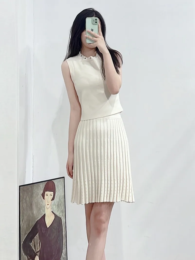 

Women Knitwear Set Sleeveless Metal Ring O-Neck Vest or Pleated High Waist A-Line Mini Skirt