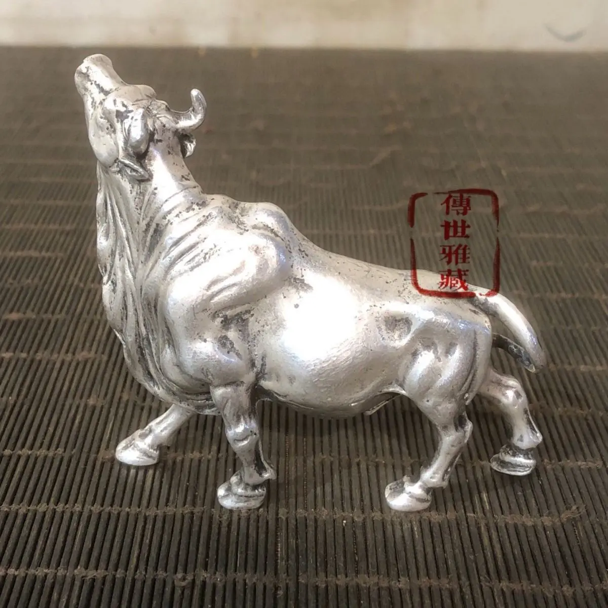 White copper high relief with bull like aura, soaring sky, patina, aged and spicy style, grand and imposing