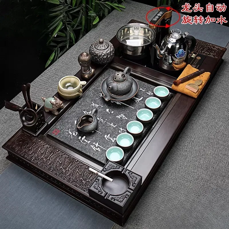

Ebony black gold stone tea tray tea set automatic fast furnace purple sand kung fu complete set of tea set for home use