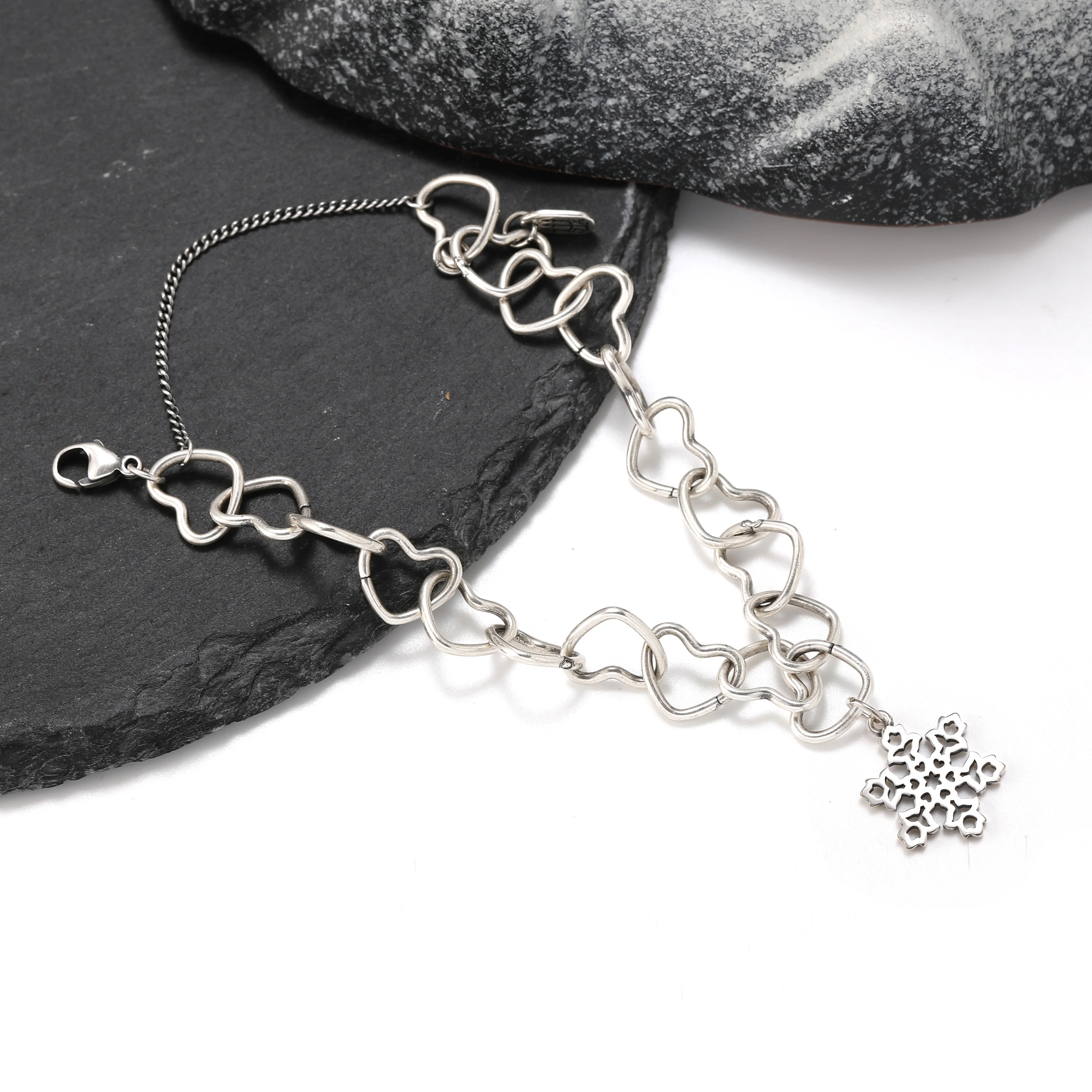 

Genuine 925 sterling silver Connected Hearts Charm Bracelet paired with Snowflakes in the Netherlands pendant