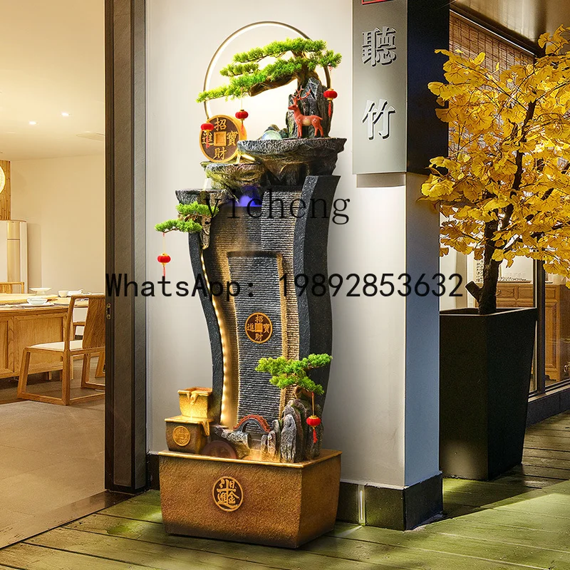 

high mountains and flowing water attract wealth, feng shui wheel and flowing water ornament living room next to the