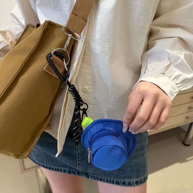Mini bolsa de almacenamiento portátil impresa, monedero multiusos para llaves, soporte para cambio, organizador de maquillaje y auriculares, bolsa colgante