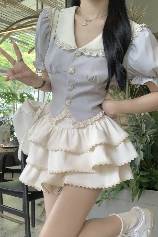 

2025 Летняя рубашка с кукольным воротником в консервативном школьном стиле с коротким рукавом + мини-пуховая юбка трапециевидной формы с высокой талией, комплект из 2 предметов, милый миниатюрный женский комплект