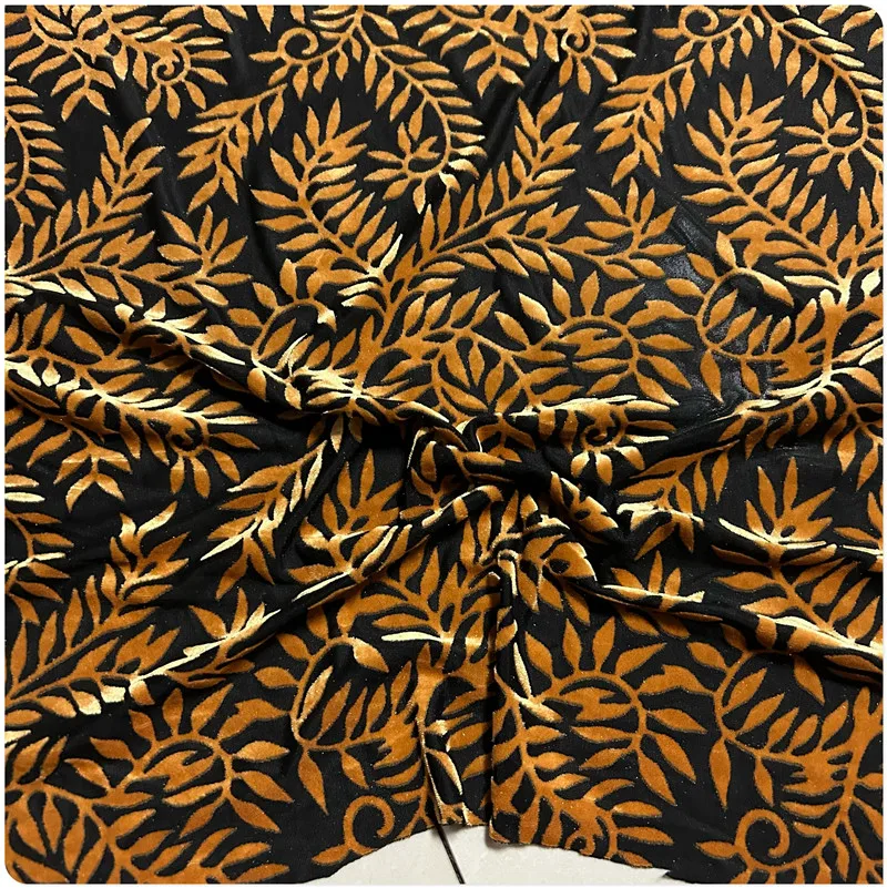 Black Stretch Velvet Fabric with Ginger Yellow Floral Patterns and Hollowed-out Gold Threads Suitable for Dresses, Tops, Blouses