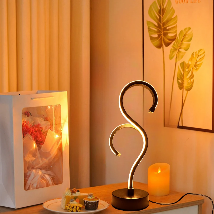 

A modern minimalist desktop lamp in the shape of a double question mark, USB-powered with three-color dimmable lighting. Suitabl
