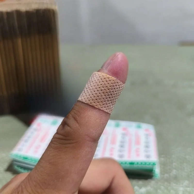 

100Pcs/Set Nnwovens Breathable Band Aid for Wound Dressing Patch Tape First Aid Strips Plaster Finger Adhesive Bandages