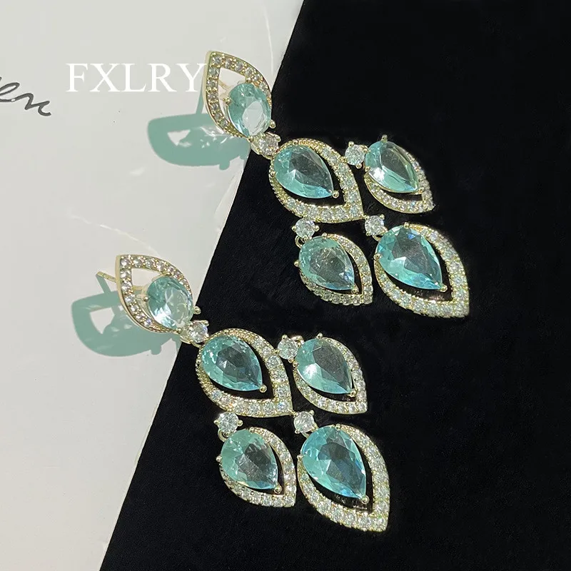 

FXLRY Fashion Inlaid Zircon Light Blue Leaf Drop Tassel Earrings S925 Silver Needle Dangler Women Wedding Jewelry