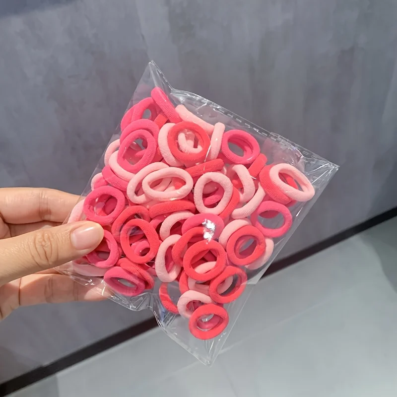 120Pcs Pink Mini Hair Ties + Zipper Bag, Non-Slip and Won'T Pull Hair, 1.98cm Ultra-Thin Ponytail Clips, Perfect for Girlfriends' Gatherings/Birthday Parties, Great Item for Styling and Beauty Looks, Birthday Gift | Independence Day | Labor Day | Thanksgiving Day | The Perfect Gift for Christmas and Other 11 Major Holidays.