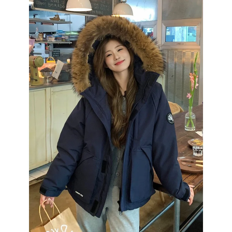 النساء 2025 الشتاء عادية فضفاض دافئ معطف مبطّن بالقطن زوجين سترة البضائع الفراء طوق سميكة أسفل سترة الملابس المبطنة بالقطن