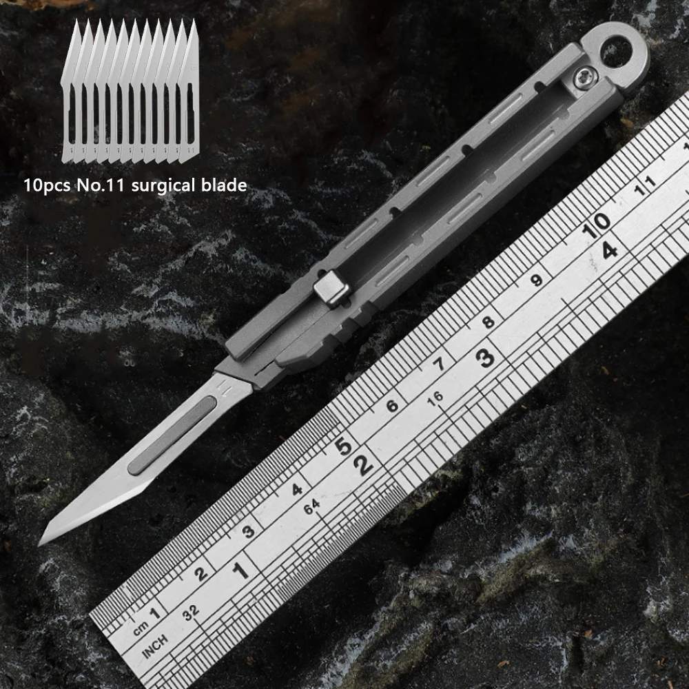 Mini Titanium Alloy Surgical Knife Acampamento ao ar Livre Open Box Art Push Knife Portátil com 10 Lâminas