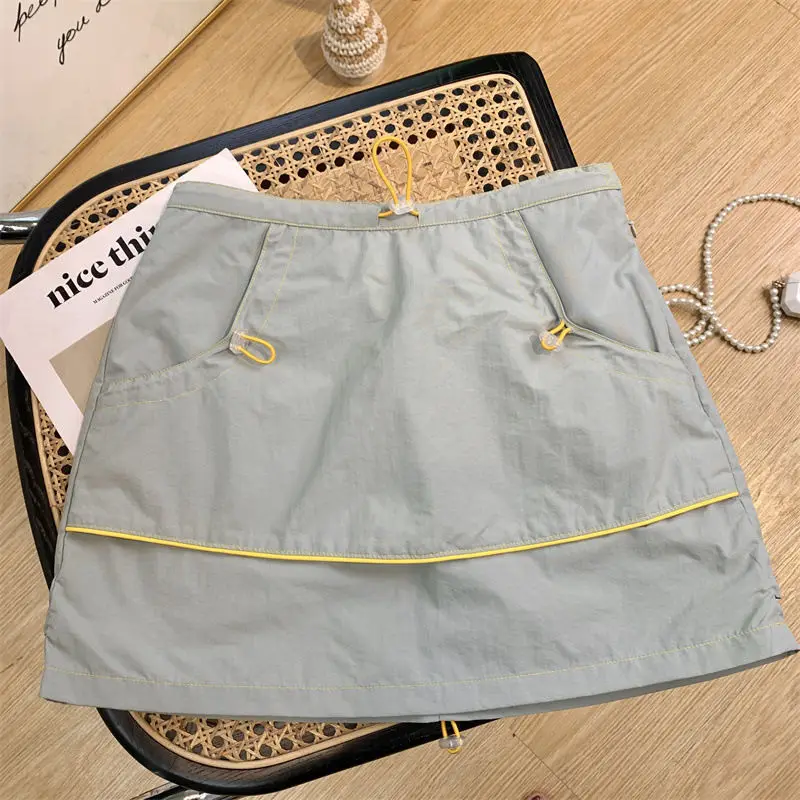 

Light green short skirt women's new thin drawstring design in the summer of 2024, sporty and casual Joker A-word hip skirt.