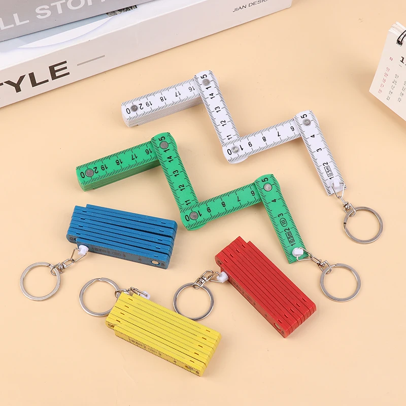 1ชิ้น0.5เมตร10พับพวงกุญแจพลาสติกความแม่นยำสูงไม้บรรทัดพับเก็บได้สำหรับการเดินทางงานไม้อิฐบ้าน DIY