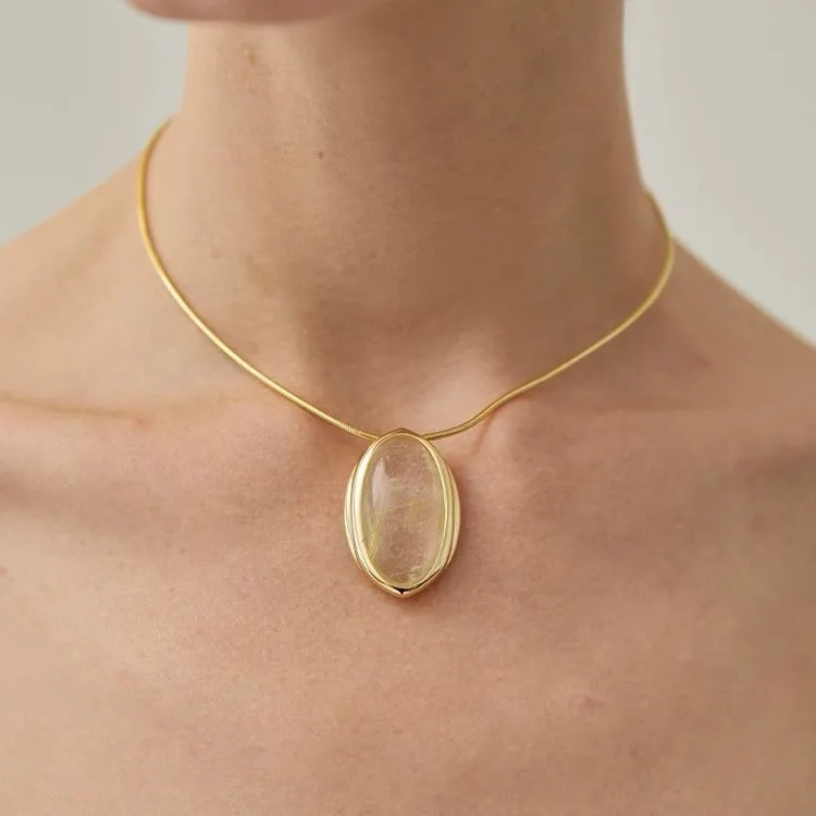 French style light luxury niche design, oval transparent crystal pendant, gold-plated necklace, adjustable sweater chain