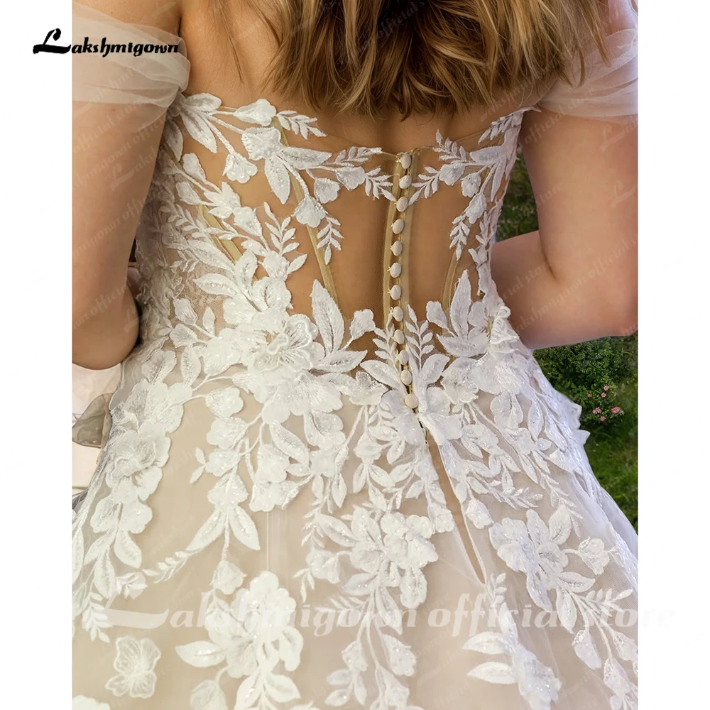 Lakshmigown เซ็กซี่สุภาพสตรีปิดไหล่ลูกไม้ Appliqués ชุดแต่งงานชายหาด Boho ชุดเจ้าสาวแขนกุด Robe 2025 ที่กําหนดเอง