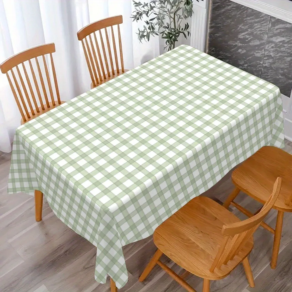 A farmhouse-style tablecloth with forest green check pattern. Multi-sized kitchen table set with a retro floral design.