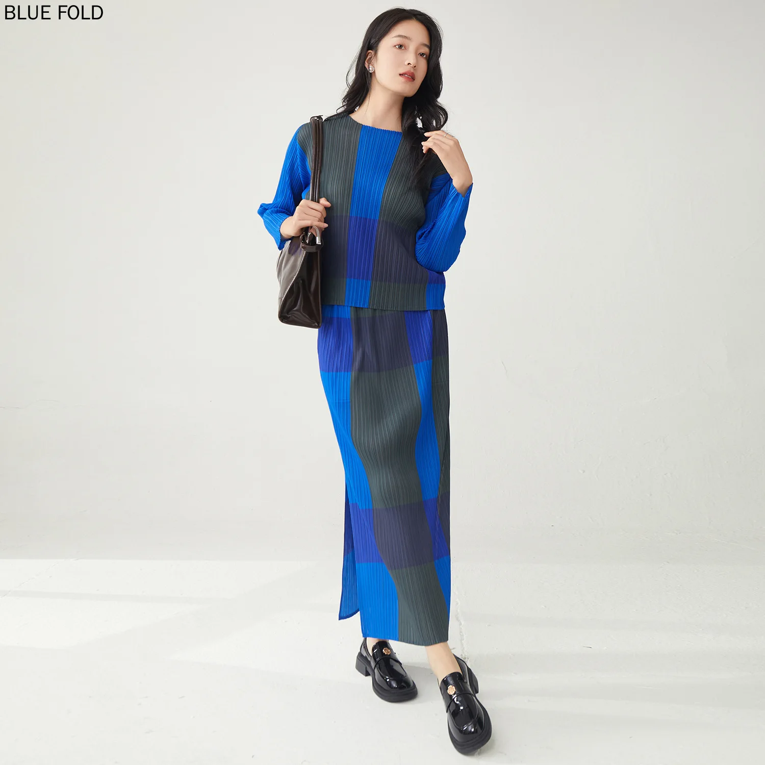 Primavera 2025 temperamento Casual Xadrez camisa de manga longa das mulheres e saia de divisão conjunto de duas peças Miyake estilo saia define