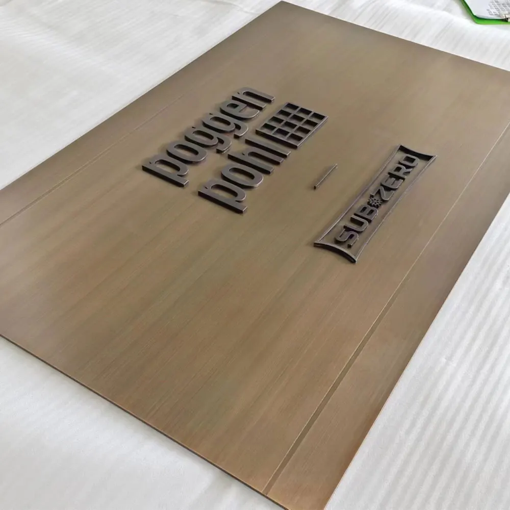 

brushed bronze stainless steel ADA plate sign with 3D cut copy letters