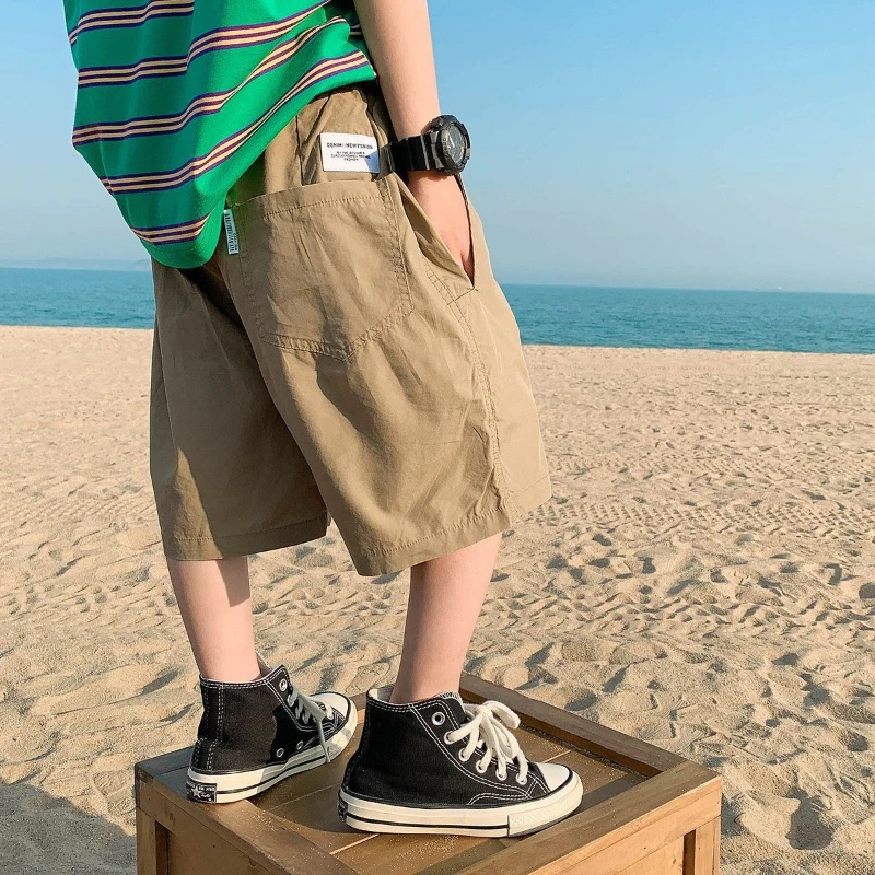 Pantalones cortos de cintura elástica para niños, ropa deportiva informal de Color sólido con letras de dibujos animados, Verano