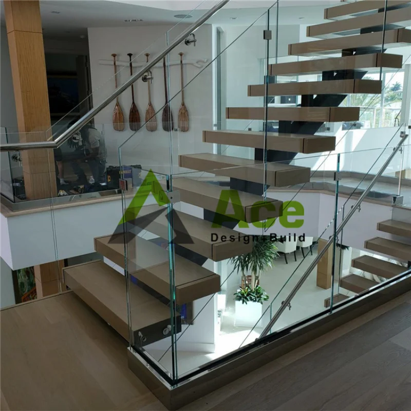 Custom.Straight floating stairs with center stringer single spine design glass railing