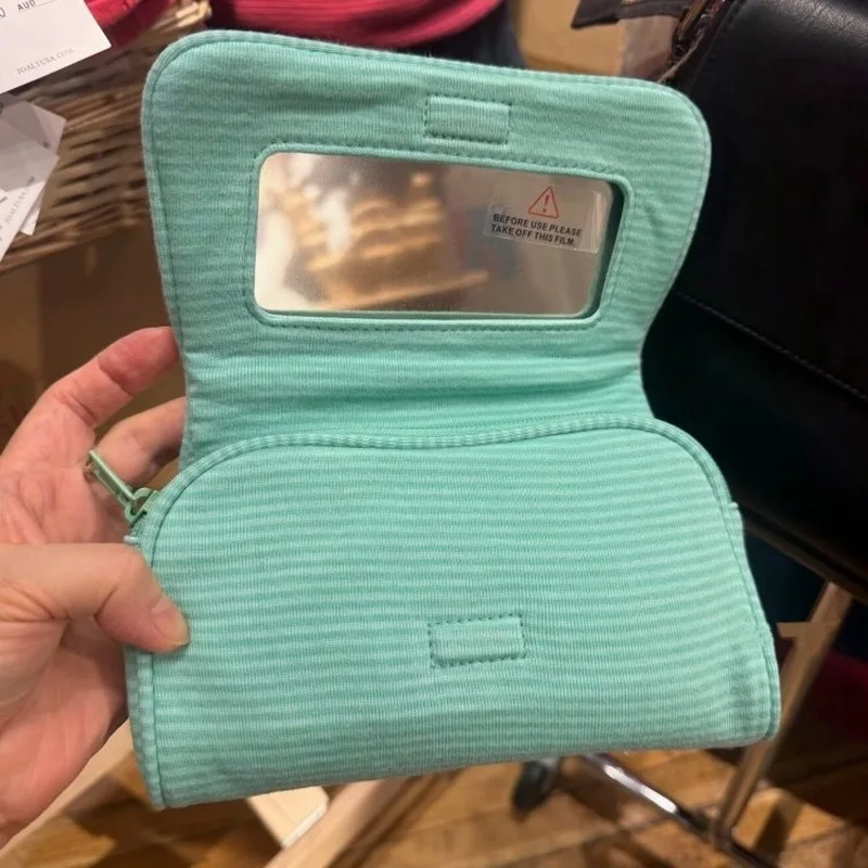 Korean StyleinsHandheld makeup bag with mirror, cute, mini, and portable, perfect for travel and organizing cosmetics
