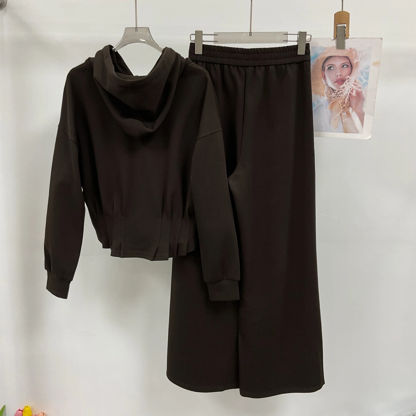 New Autumn Collection: A sleek, sophisticated hooded, waist-cinching jacket paired with wide-leg trousers.NO.29