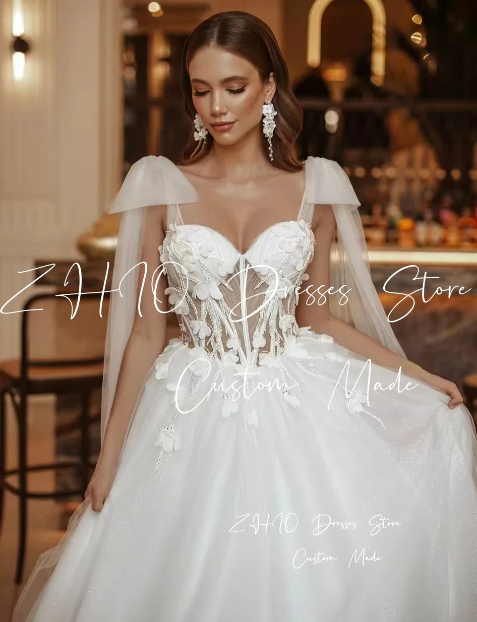 ZHIO Fiori eleganti Abito da sposa Fiocco senza spalline Corsetto Sweep Train Avorio Tulle Abito da sposa Abiti da sposa personalizzati