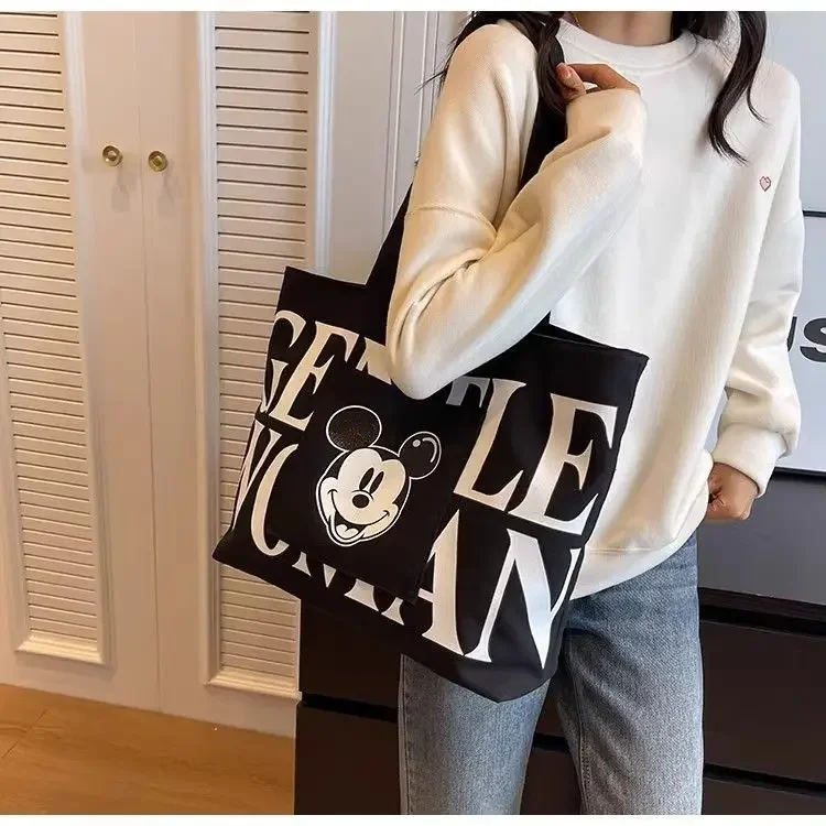 Disney 2025 New Mickey Large Capacity Canvas Bag Female Cartoon Versatile Shoulder Bag Student Class Commuting Tote Bag