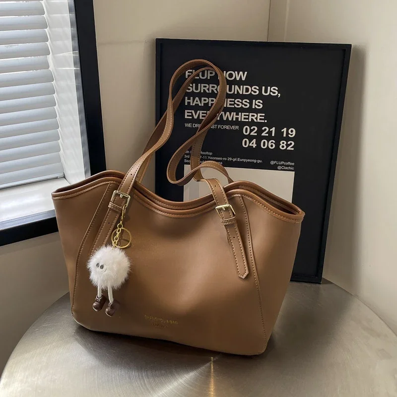 

Large Capacity Commuting Tote Bag for Women's Summer 2024 New Versatile Casual Shoulder Bag Simple College Student Class Bag