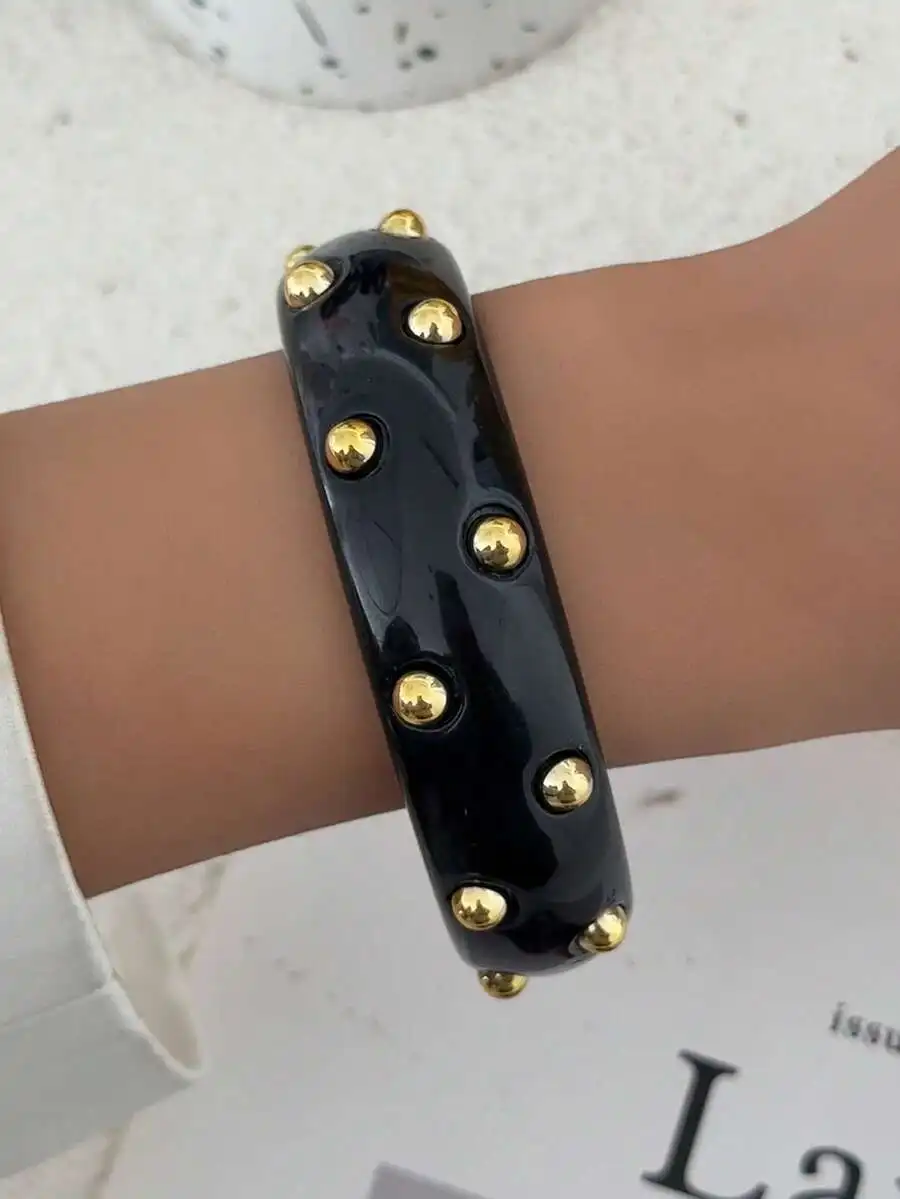 

Black Resin Cuff Bracelet With Gold Tone Rivets Bohemian Geometric Style Women Fashion Jewelry