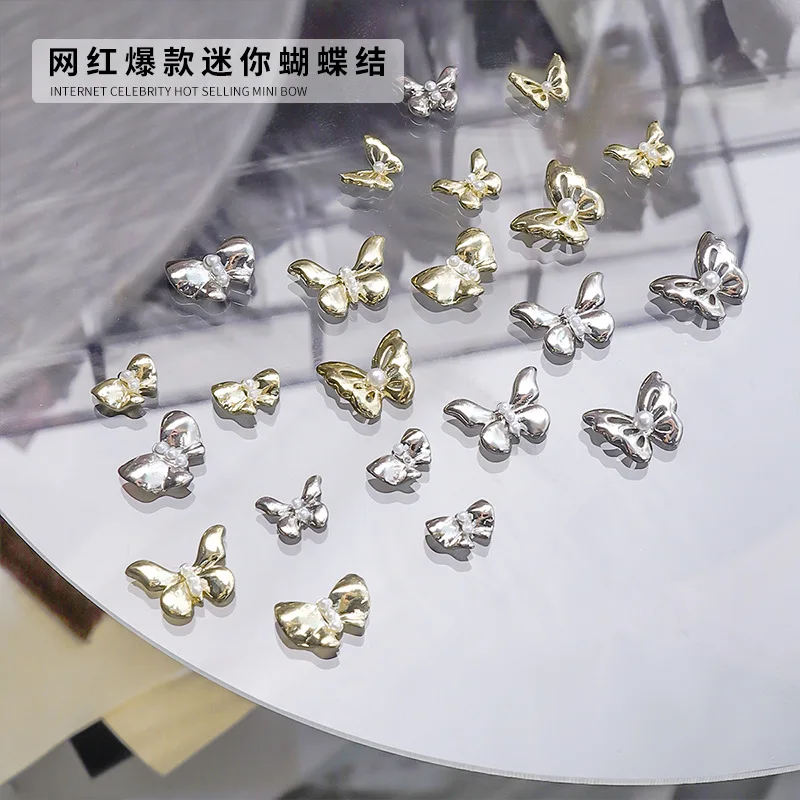 20PCS Luxury White Pearl 3D Glossy Metallic Butterfly Mini Bow Alloy Nail Art Rhinestones Decorations Manicure Charms Suppliers