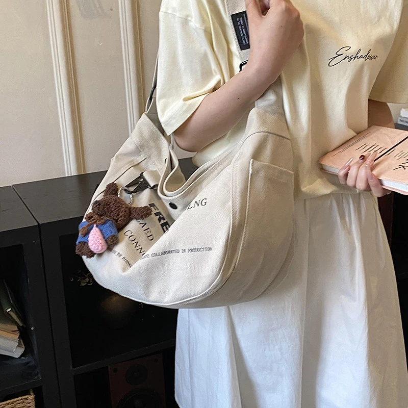 

Letter print canvas bag for women2026Spring new trendy fashion tote bag for students, large capacity crossbody bag for school