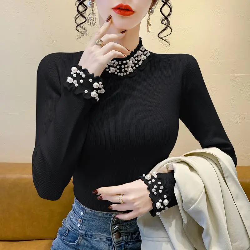 الكورية نمط شتاء جديد شبه عالية الياقة الدانتيل الصناعة الثقيلة مسمار حبة سميكة محبوك سترة المرأة أنيقة التخسيس