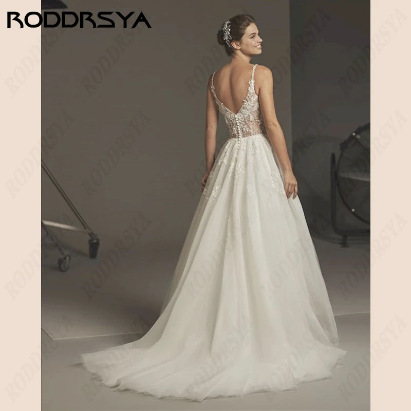 RODDRSYA A-Line Wedding Dresses V-Neck Lace Applique Vestido De Noiva Spaghetti Straps Tulle Bride Party Illusion Button Back