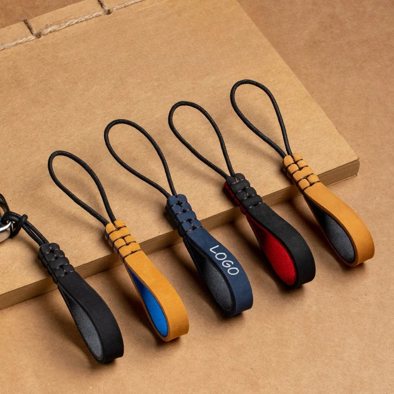 Aangepaste LOGO sleutelhanger blanco echt leer handgemaakte hangende touw auto hanger slijtvaste koeienhuid gepersonaliseerde sleutelhangers