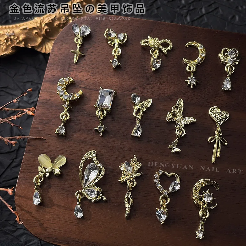 

Gold Mixed Style Luxury Nail Art Dangle Accessories Love Moon Bow 3D Nail Charms Bulk Alloy Rhinestones Nail Art Decoration DIY