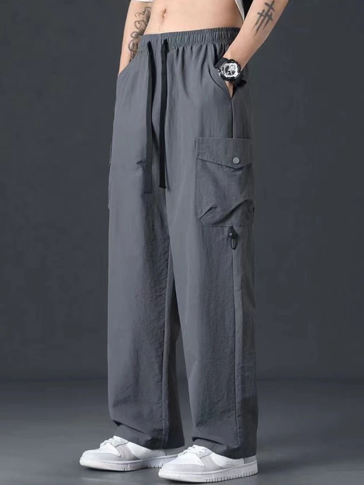 Męskie spodnie oversize na wiosnę i lato, proste, czarne, w stylu koreańskim, nowość, estetyczne, tanie spodnie typu slacks, nylonowe spodnie cargo streetwearowe dla mężczyzn.