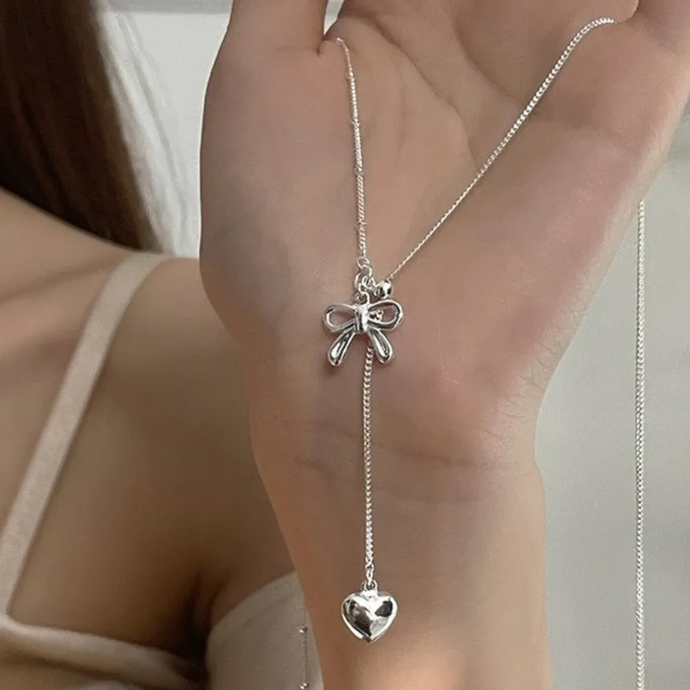 PANJBJ 925 Sterling Silver Sweet Bowknot Necklace for Women Minimalist Love Heart Tassel Bead Hollowed Out Jewelry Gift Dropship