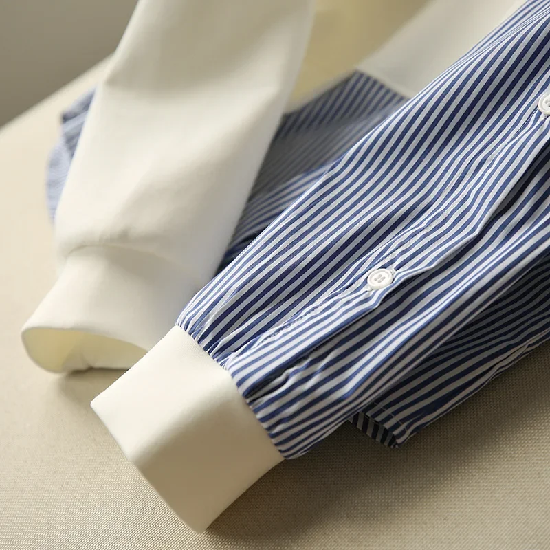 ملابس نسائية ربيعية جديدة لعام 2025 سترة بغطاء للرأس مخططة غير متماثلة على شكل خفاش فضفاضة برقبة مستديرة للنساء