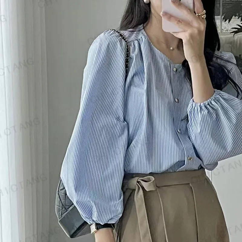 

2025 Korean Chic Spring Summer New Design Sense Niche Unique Heart Button Round Neck Long Sleeve Striped Shirt for Women