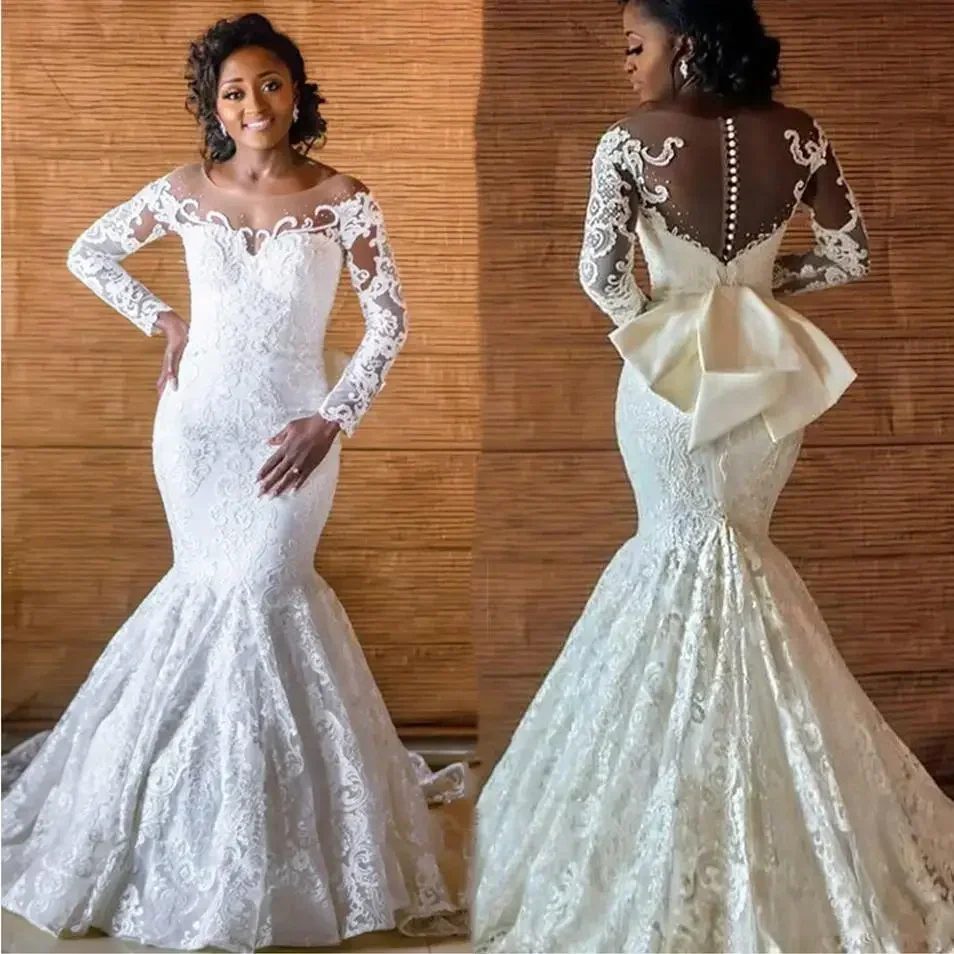 Abiti da sposa africani personalizzati in pizzo a sirena Vestido De Noiva Abiti da sposa da donna Manica lunga Fiocco con bottoni posteriori Sposa trasparente