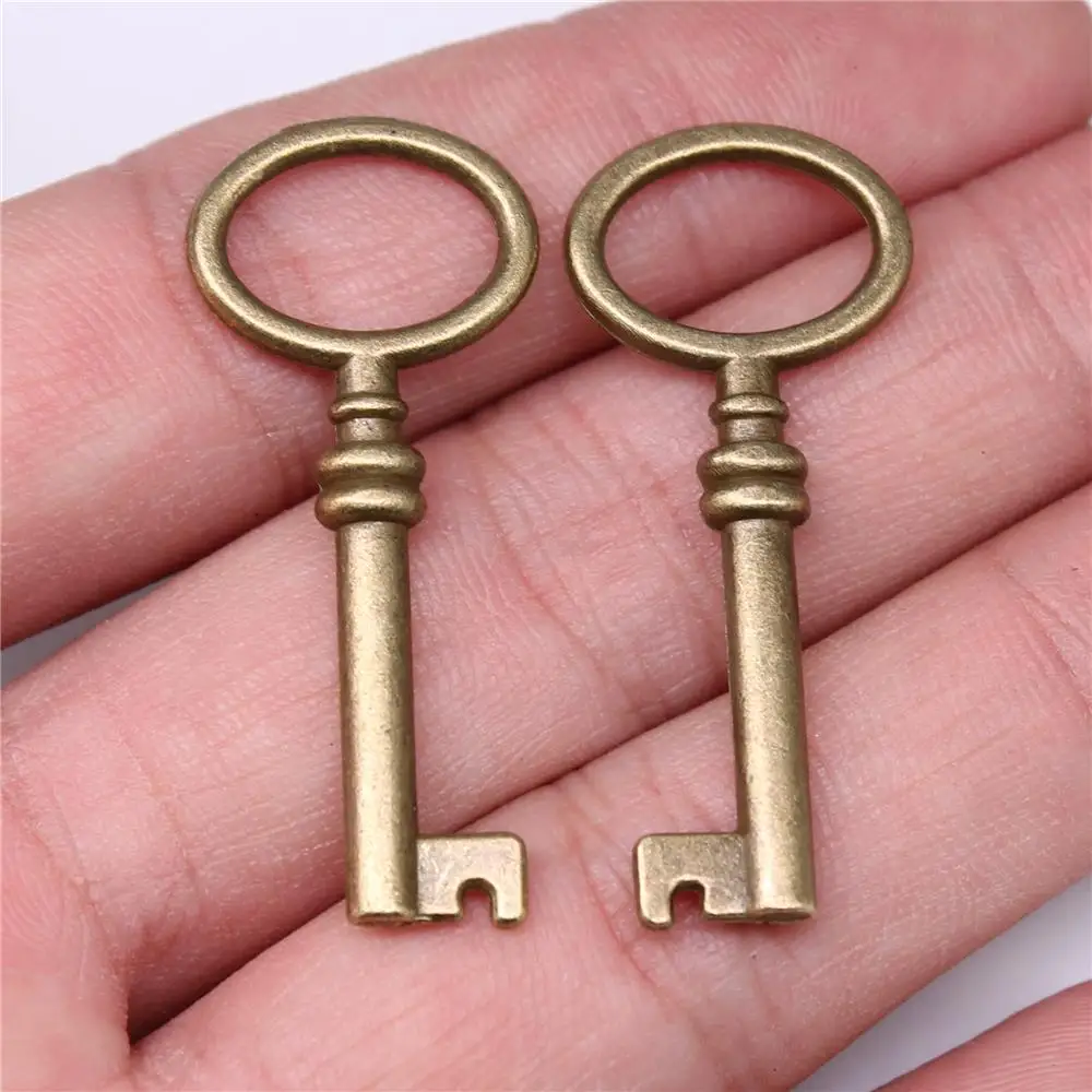 WYSIWYG 10 sztuk Charms 41x17mm kluczowe zawieszki do tworzenia biżuterii DIY komponenty do biżuterii antyczny brąz kolor stop Charms wisiorek