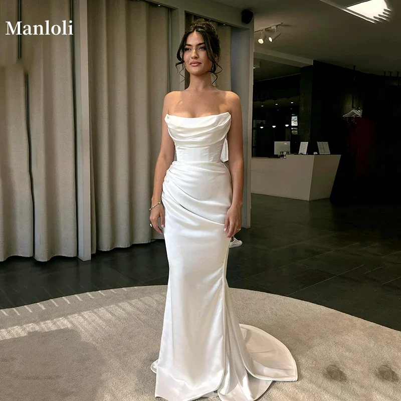 Manloli カスタマイズされたエレガントなストラップレスマーメイドウェディングドレスボヘミアンオフショルダーフロアスタイルホワイトプリーツウェディングドレス