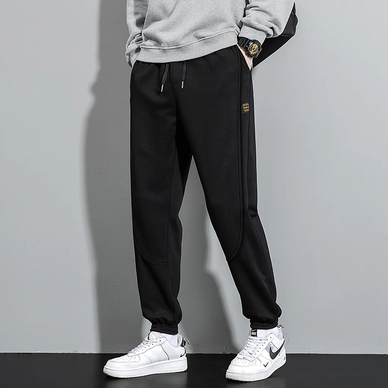 Fashion Solid Color Pockets Spliced Casual Pants Men's Clothing 2024 Spring Autumn New Loose Elastic Lace Up High Waist Trousers