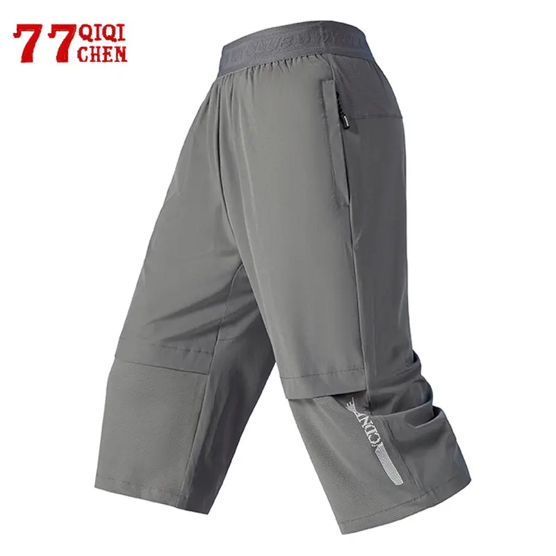 Pantaloncini estivi in seta di ghiaccio da uomo elastico in vita ad asciugatura rapida pantaloni sportivi Casual sottili moda palestra allentata Sport Running pantaloncini al polpaccio