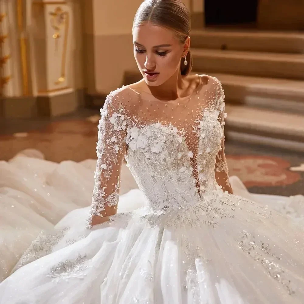 Luxury Puffy Wedding Dress 2026 Long Sleeve Sheer O Neck 3D Flowers Lace Beads Birde Bridal Gowns Vestido De Novia