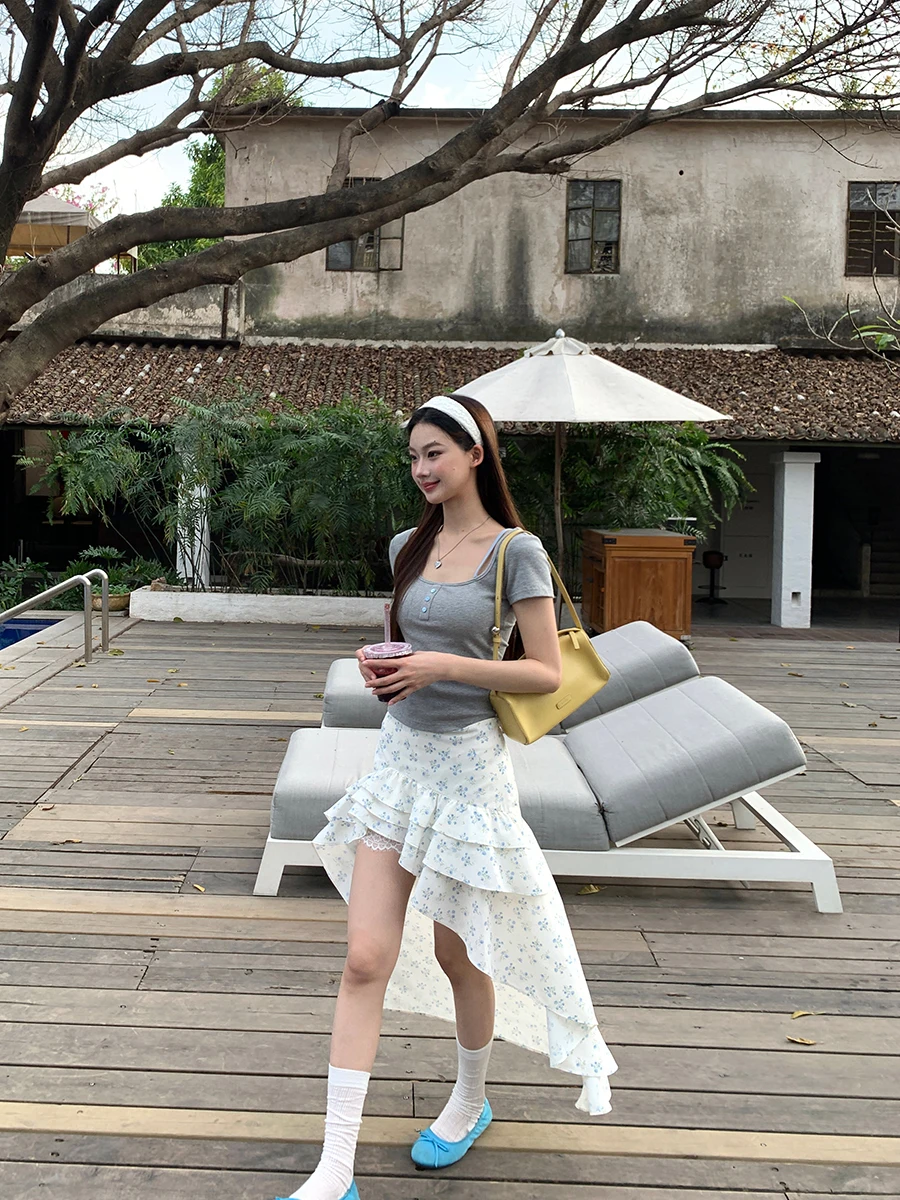 Biała spódnica damska z wysokim stanem, asymetrycznym krojem w kształcie litery A, z kwiatowym nadrukiem, nowa letnia spódnica z wysokim stanem, spódnice damskie.