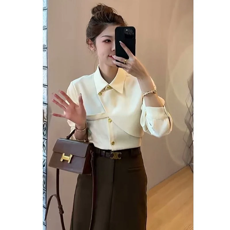 Elegant Lapel Button Solid Color Asymmetrical Shirts Women\'s Clothing 2023 Autumn Winter Loose Korean Tops Office Lady Blouses