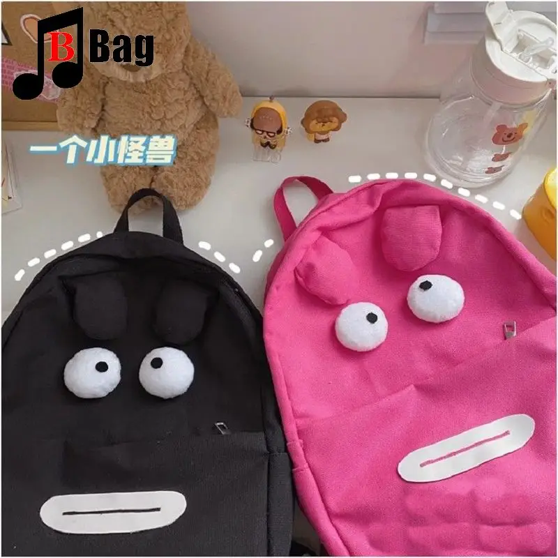 Canvas cute funny little monster backpack high school bag large capacity primary school students three to six grade backpack