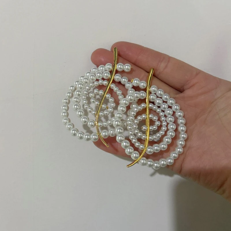 

Niche design temperament, retro, pearl circle spiral earrings, vacation and travel jewelry