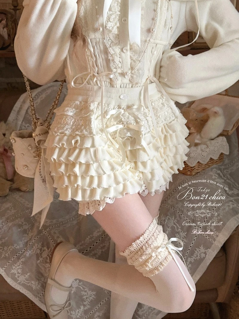 النمط الفرنسي Kawaii الملابس الوردي السراويل القصيرة كريم سحابة الخريف والشتاء جديد الحلو كولوتيس محبوك الطبقات كعكة تنورة السراويل